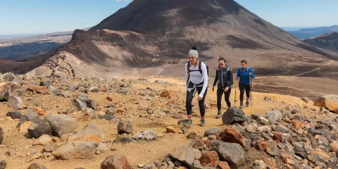 Hikers trekking the Tongariro Alpine Crossing with Mt Ngāuruhoe