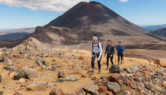 Hikers trekking the Tongariro Alpine Crossing with Mt Ngāuruhoe
