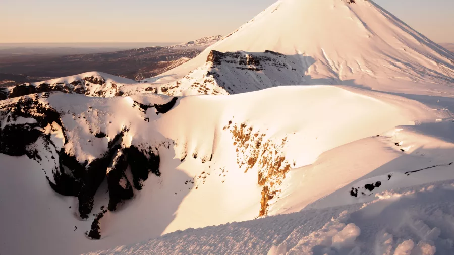 Snowy Mt Ngāuruhoe at sunset on Tongariro Alpine Crossing