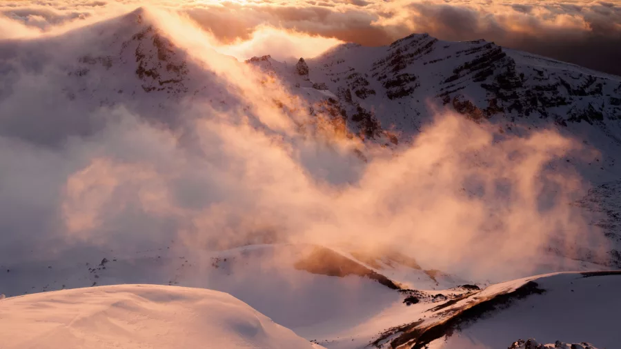 Snow-covered peaks in Tongariro National Park at sunset in winter