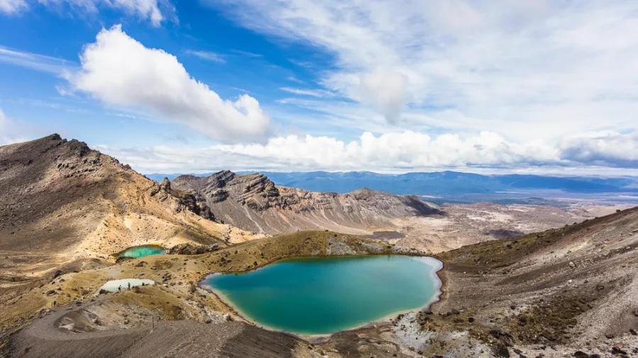 View of the Emerald Lakes and volcanic landscape along the Tongariro Alpine Crossing in New Zealand.