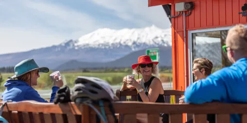 People enjoying coffee with view of Mt Ruapehu in Waimarino