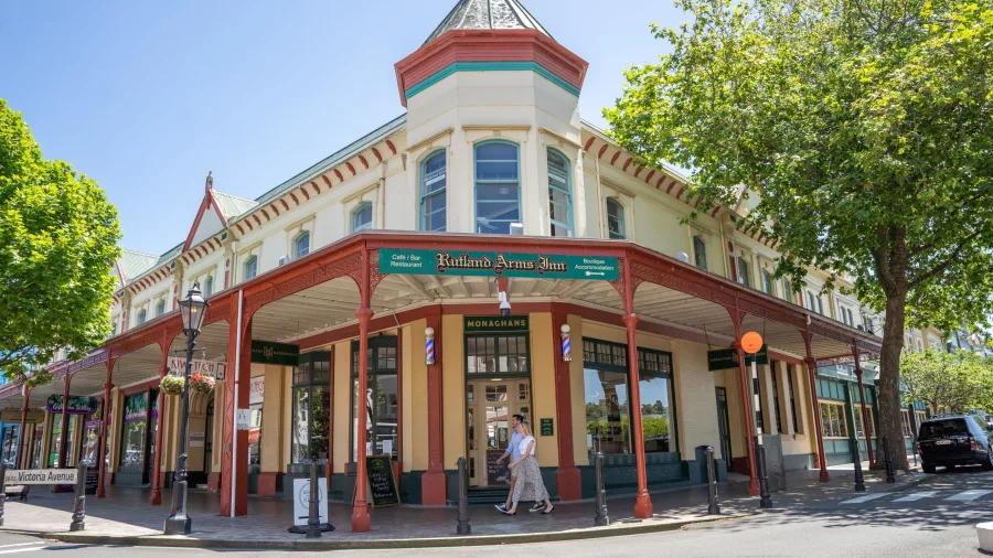 The historic Rutland Arms Inn and Monaghans Barbershop on a sunny day in central Whanganui