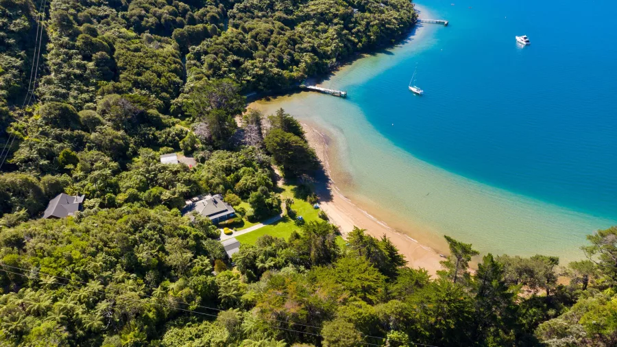 Aerial view of Mahana Lodge nestled at Endeavour Inlet along the Queen Charlotte Track in Marlborough Sounds