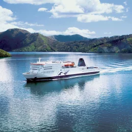 Interislander ferry cruising through the Marlborough Sounds on a sunny day