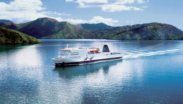 Interislander ferry cruising through the Marlborough Sounds on a sunny day