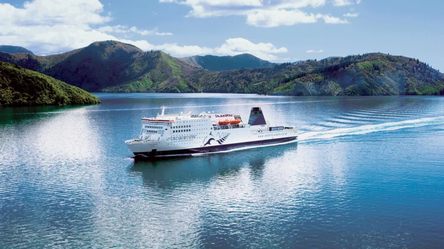 Interislander ferry cruising through the Marlborough Sounds on a sunny day