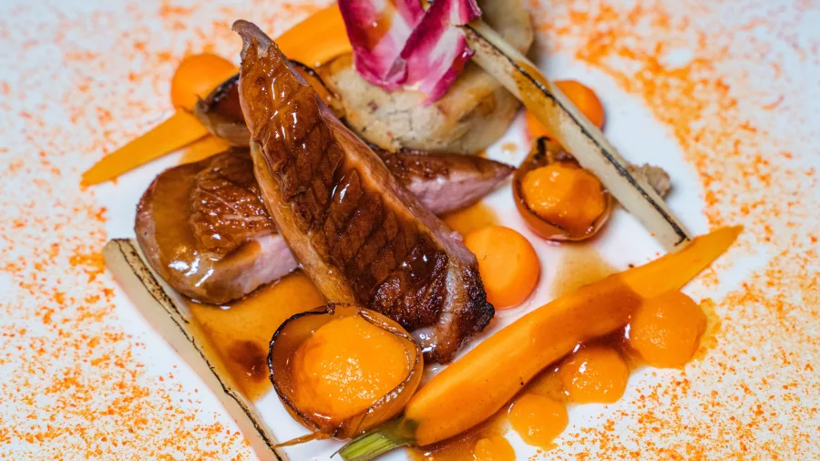 Gourmet duck dish served at the fine dining restaurant at Bay of Many Coves.