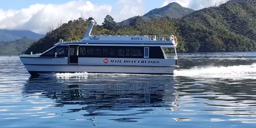 Mailboat travelling calmly through Marlborough Sounds near Picton.