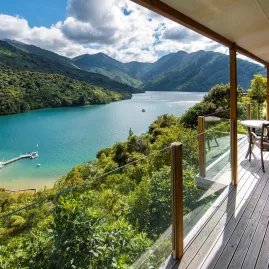 Stunning view from a balcony at Punga Cove overlooking Endeavour Inlet and native bush.