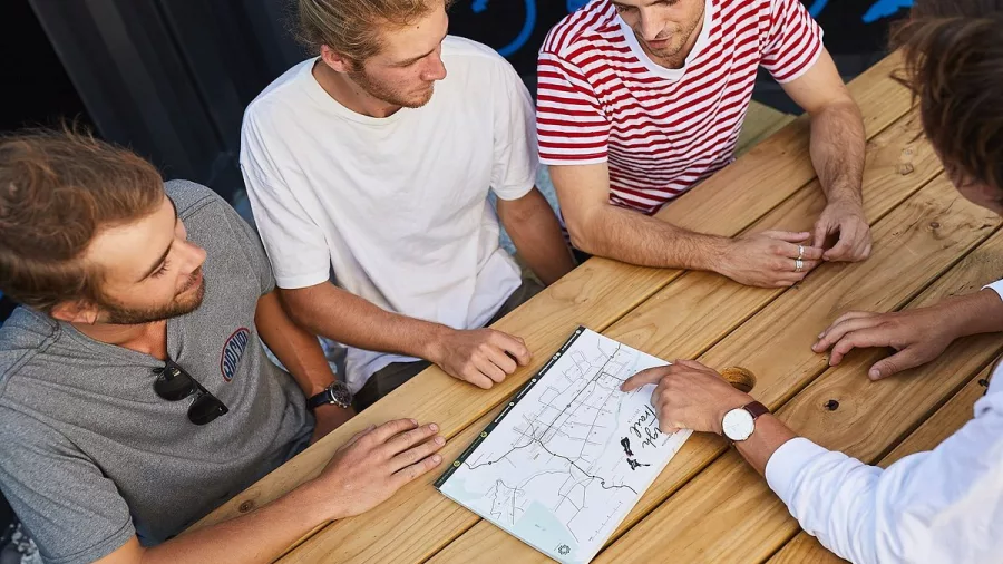 Bike hire staff helping cyclists plan their self-guided wine tour in Marlborough