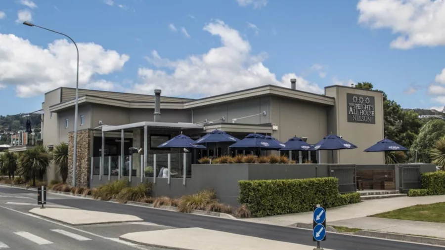 Speight’s Ale House exterior with outdoor seating area in Nelson, New Zealand