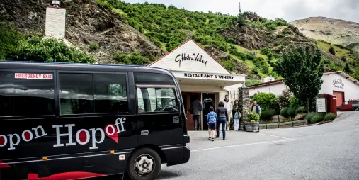 Hop On Hop Off tour bus outside Gibbston Valley Winery in Queenstown
