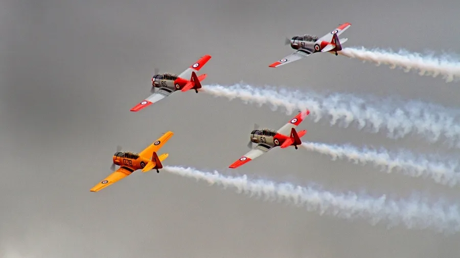 Four vintage warbirds flying in tight formation at Classic Fighters Omaka Air Show