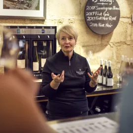 Wine expert guiding tasting at a Marlborough cellar door