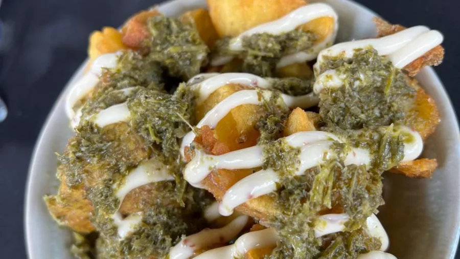 Crispy patatas bravas topped with herbed pesto and aioli, served during a Marlborough wine tour.