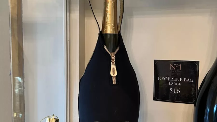 Sparkling wine bottle from No.1 Family Estate in a neoprene gift bag with decorations