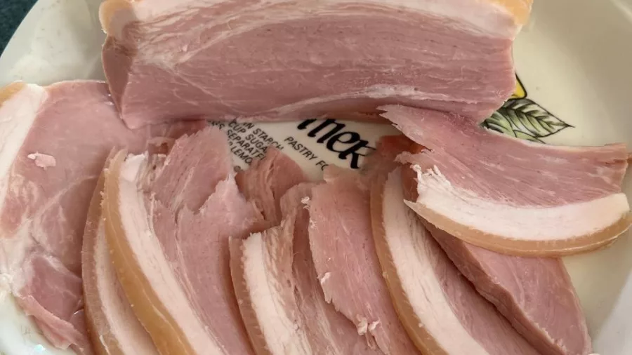 Plate of thick-cut artisan bacon ready for tasting