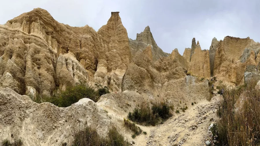 Towering natural rock formations at the Clay Cliffs near Omarama, with dramatic spires and rugged terrain.