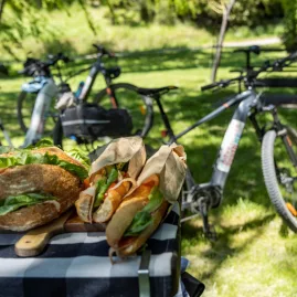 Fresh sandwiches prepared for cyclists during an Adventure South NZ guided tour lunch stop.