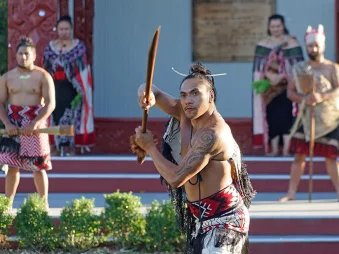 Māori performers in traditional dress during a cultural welcome at Te Puia in Rotorua