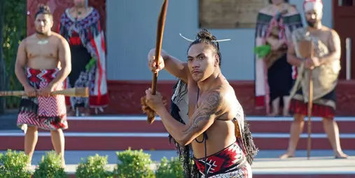 Māori performers in traditional dress during a cultural welcome at Te Puia in Rotorua