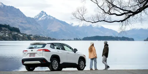 Toyota Corolla Cross Hybrid parked beside Lake Wakatipu in Queenstown