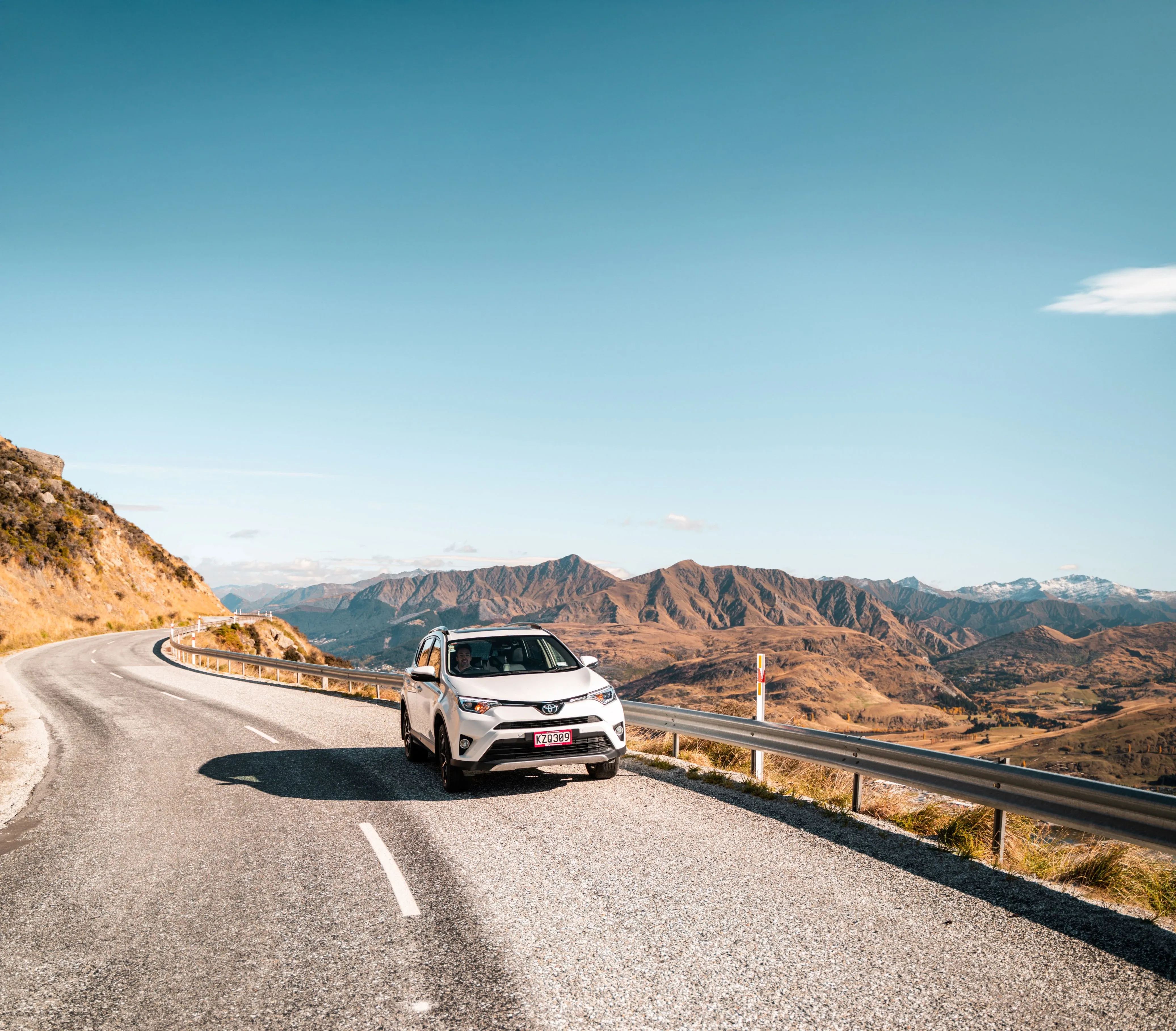 Toyota RAV4 Hybrid SUV driving along the Crown Range Road near Queenstown