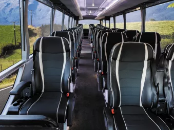 Interior view of Grand Pacific’s Signature coach showing wide, comfortable seating and panoramic windows