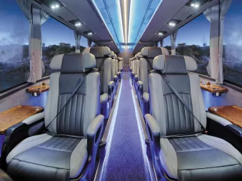 Interior of the Ultimate coach with spacious, leather-trimmed business class seats