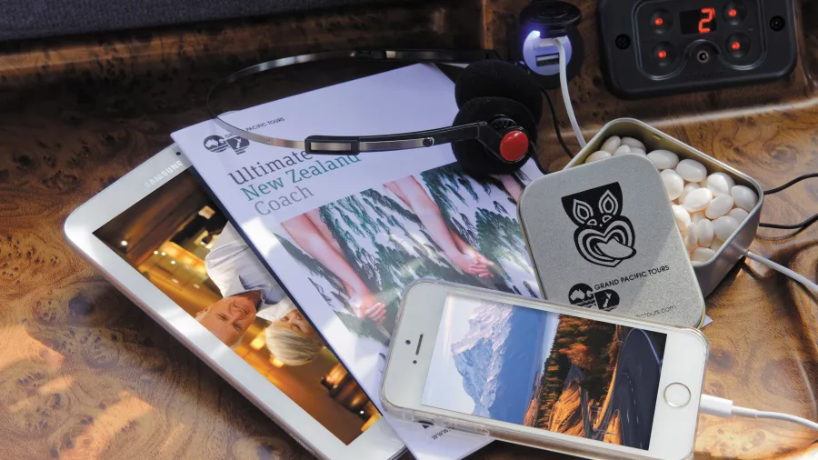 Entertainment system, travel guides, and charging ports available on the Ultimate coach