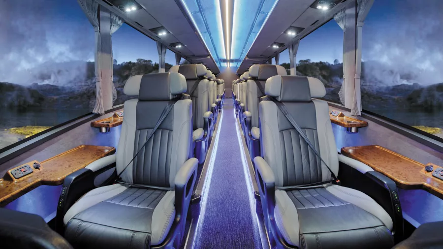 Interior of the Ultimate coach with spacious, leather-trimmed business class seats