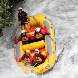 Adventurers white water rafting down a rapid on the Kaituna River in New Zealand
