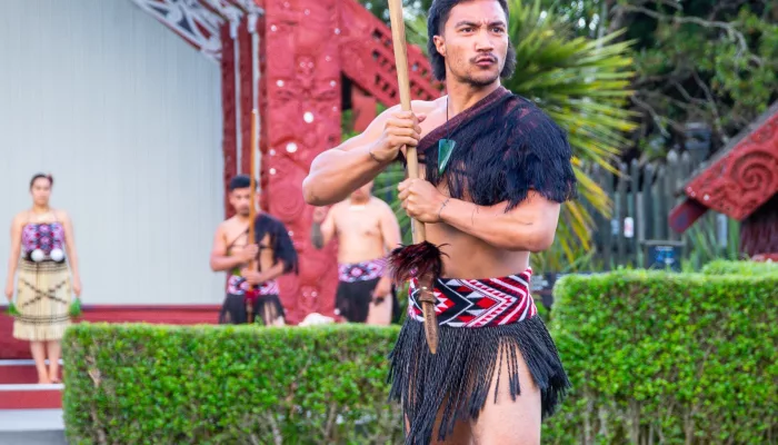 Māori warrior performs traditional wero challenge at Te Puia, Rotorua