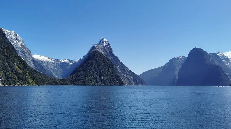 Majestic Mitre Peak and surrounding fiords in Milford Sound on a clear day