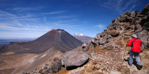Hiker walking near Mount Ngauruhoe on the Tongariro Alpine Crossing