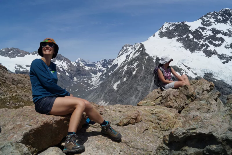 Hikers resting with views from Mueller Ridge in Mount Cook National Park