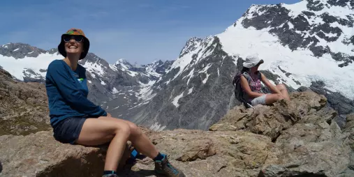 Hikers resting with views from Mueller Ridge in Mount Cook National Park