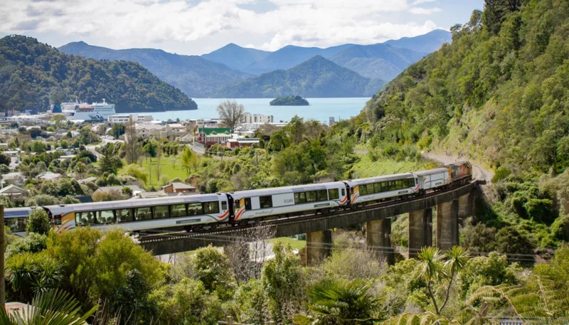 Coastal Pacific train crossing viaduct near Picton with Marlborough Sounds in background