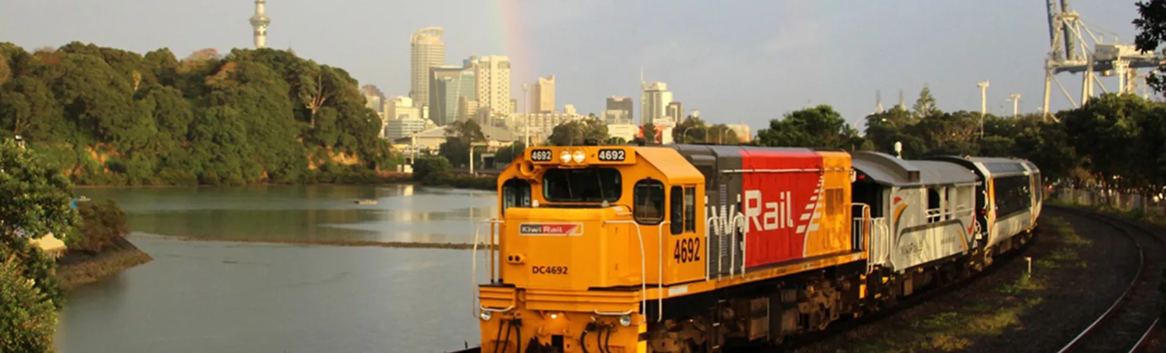 Northern Explorer train leaving Auckland City, Sky Tower
