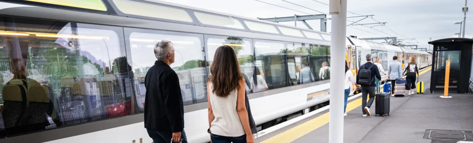Couple with luggage ready to board the Northern Explorer Train, Auckland, North Island