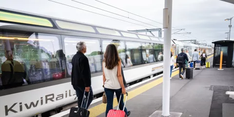 Couple with luggage ready to board the Northern Explorer Train, Auckland, North Island