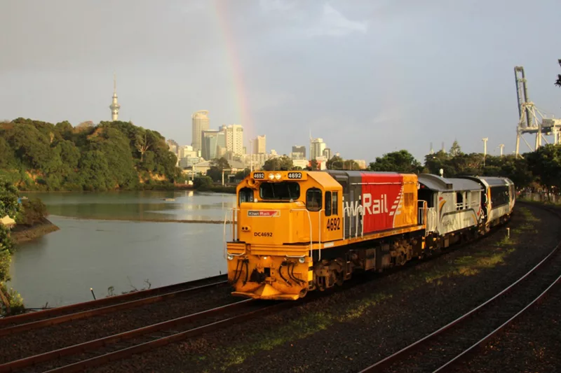 Northern Explorer train leaving Auckland City, Sky Tower