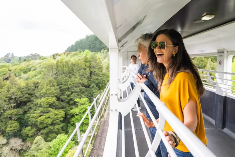Couple enjoying open-air train carriage on the Northern Explorer Train