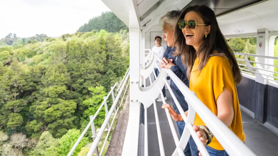 Couple enjoying open-air train carriage on the Northern Explorer Train