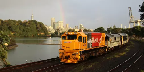 Northern Explorer train leaving Auckland City, Sky Tower