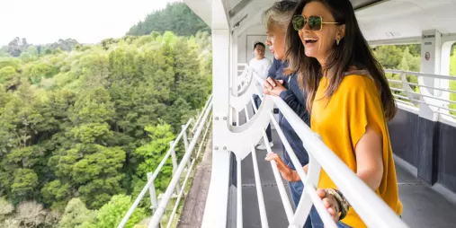 Couple enjoying open-air train carriage on the Northern Explorer Train
