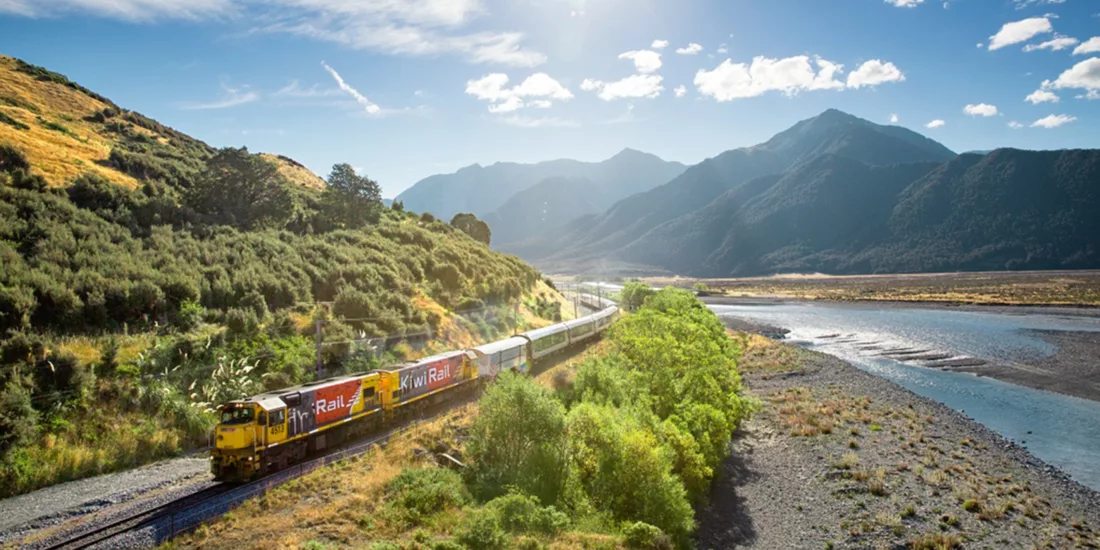 TranzAlpine Train by Waimakariri River in Canterbury near Christchurch