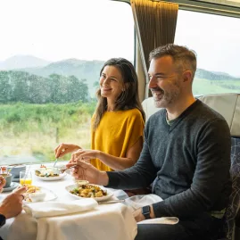 Friends dining in Scenic Plus carriage aboard the TranzAlpine