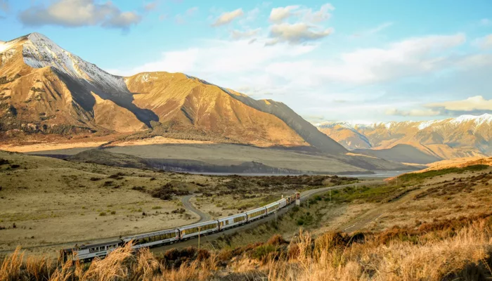 TranzAlpine train travelling past Mount Binser in Arthur’s Pass